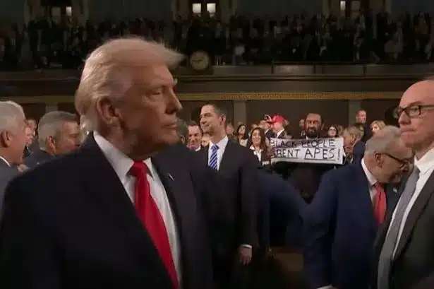 Trump Meets ‘Black People Aren’t Apes’ Sign at State of the Union Arrival