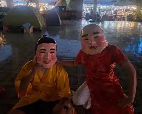 Bangkok Police Nab Thief in Lion Dance Disguise at Temple Fair