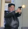 Kim Jong Un Tests New Pistol with Daughter at Munitions Plant