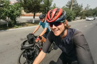 Father-Son Duo Cycles Globe in 400 Days, China Shines Brightest