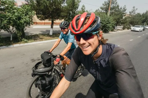 Father-Son Duo Cycles Globe in 400 Days, China Shines Brightest