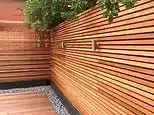 What Your Garden Fence Reveals: Grey Paint Bad Taste to Posh Natural Edges