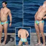 Rob Mills Makes a Splash in Duck-Themed Swimwear at Sydney Beach