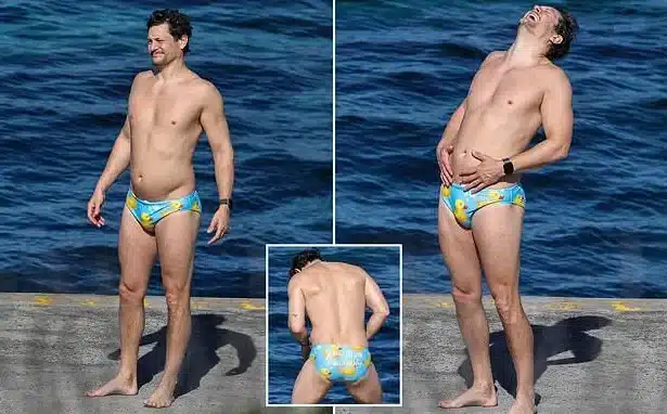 Rob Mills Makes a Splash in Duck-Themed Swimwear at Sydney Beach